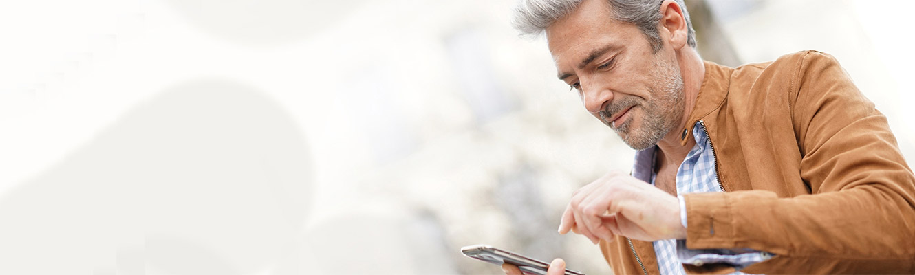 Older man using smart phone.