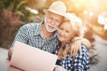 Mature couple using computer