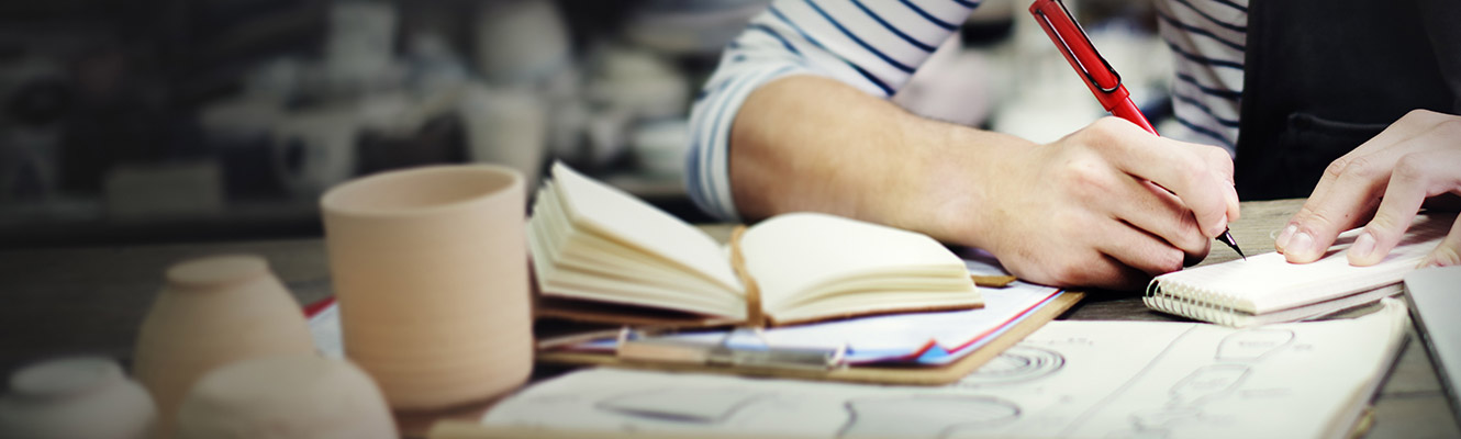 Man going over his finances at his desk.