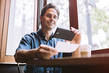 Man scanning check with phone